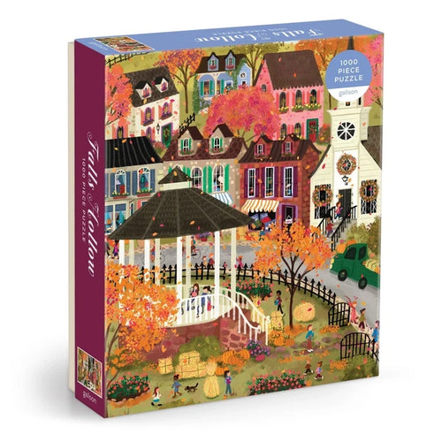 The Galison Joy Laforme Falls Hollow 1,000 Piece Jigsaw Puzzle showcases a delightful illustration by Joy Laforme, depicting a gazebo surrounded by vibrant autumn scenery in a charming village with houses, trees, people, and festive seasonal decorations—an ideal choice for lovers of New England fall puzzles.
