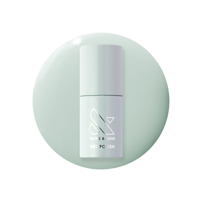 KMC - Gel bottle displayed on a soft sage green background representing a long-lasting gel polish by Olive and June