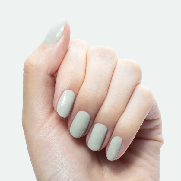 KMC - Gel shown on hand with smooth sage green nails for a long-lasting gel polish manicure by Olive and June