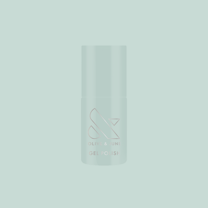KMC - Gel bottle shown in sage green packaging on a matching background representing long-lasting gel polish by Olive and June