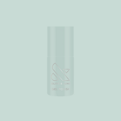 KMC - Gel bottle shown in sage green packaging on a matching background representing long-lasting gel polish by Olive and June