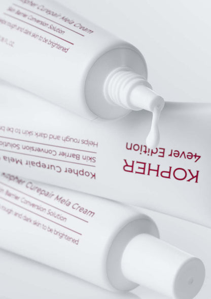 Kopher skincare product with white cream being squeezed out on a white background