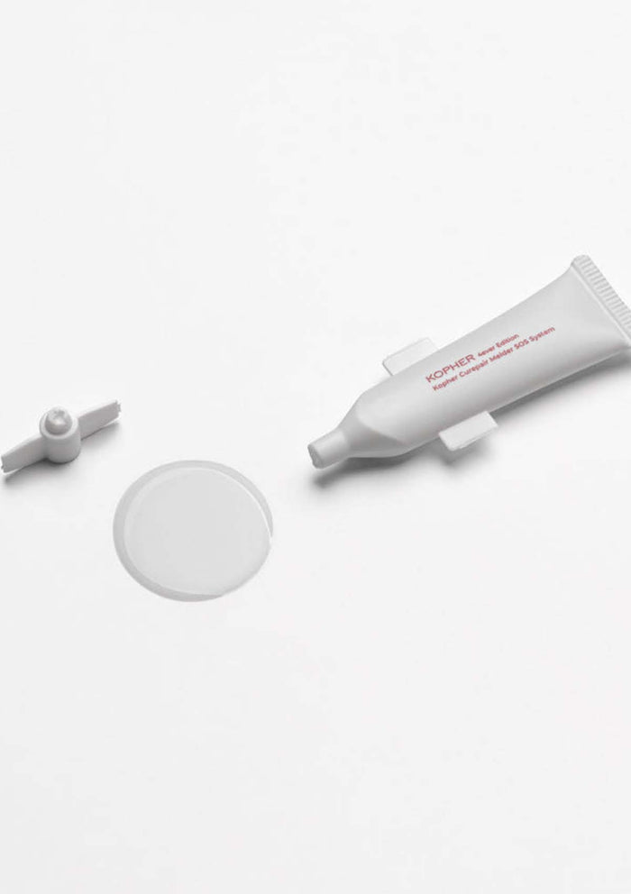 Skincare product with applicator on a white background