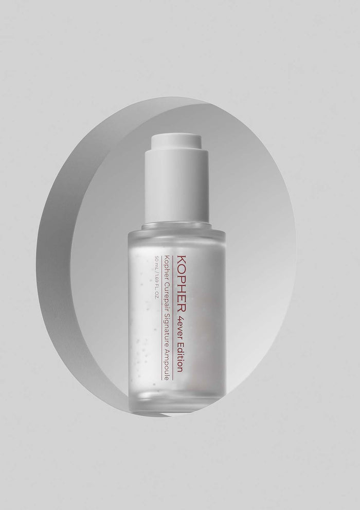 Kopher skincare serum bottle on a gray background