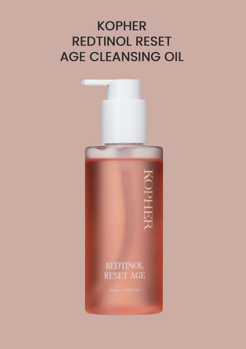 Kopher Redtinol Reset Age Cleansing Oil bottle on a beige background