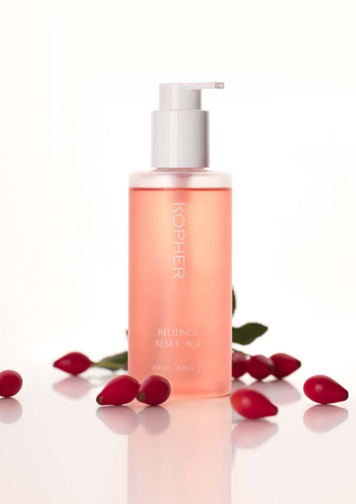 Kophier skincare product with red berries on a white background