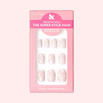 Lightning Strike | Extra Short | Squoval - Tab Press-On neutral press-on nails with minimalist white lightning bolt design in pink packaging