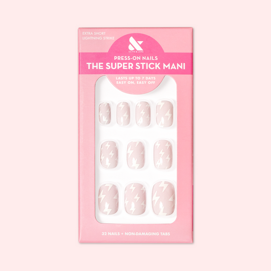 Lightning Strike | Extra Short | Squoval - Tab Press-On neutral press-on nails with minimalist white lightning bolt design in pink packaging