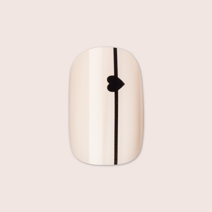 Linear Hearts | Short | Squoval - Tab Press-On neutral beige false nail with thin black line and small heart detail centered vertically