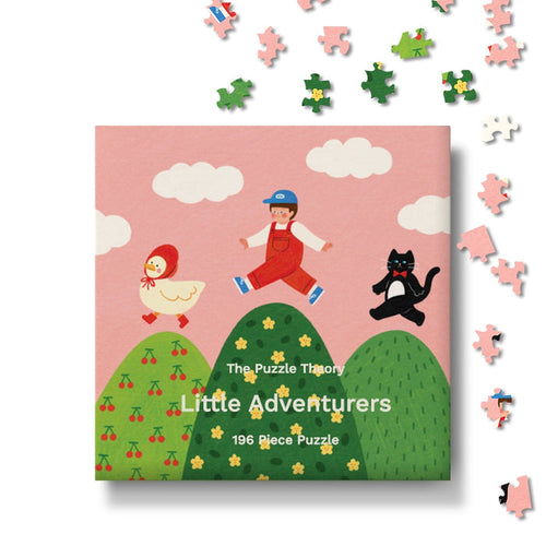 Introducing Little Adventurers | 196 Piece Jigsaw Puzzle by The Puzzle Theory—a whimsical children’s puzzle featuring a charming illustration of a child, a cat, and a duck strolling across rolling green hills, with loose pieces inviting playful assembly. Crafted from recycled paperboard, this delightful puzzle blends eco-friendly fun with imaginative play.