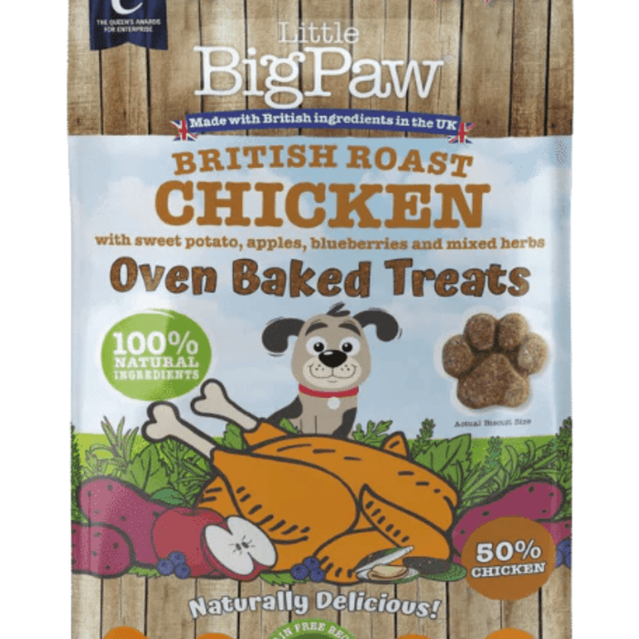 White background with a close up of a packet of Little BigPaw 'British Roast Chicken with sweet potato, apples, blueberries and mixed herbs' dog treats. Pictured on the packet is an illustration of a grey dog with a cooked chicken, fruit and vegetables in the foreground. Text on the bag says 'Oven Baked Treats, 100% natural ingredients, Naturally delicious! 50% chicken'.