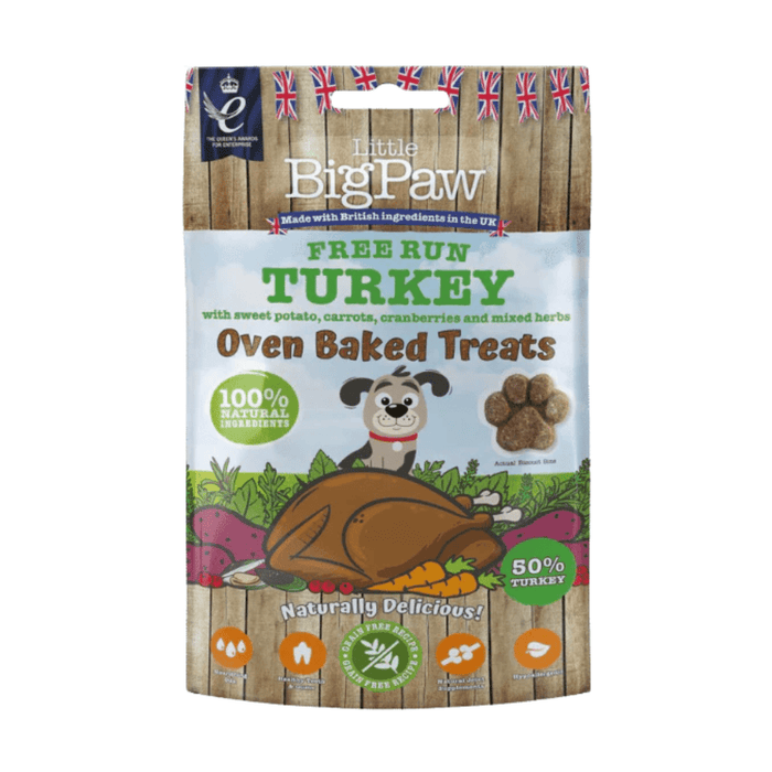 White background with a packet of Little BigPaw 'Free Run Turkey with sweet potato, carrots, cranberries and mixed herbs' dog treats. Pictured on the packet is an illustration of a grey dog with a cooked turkey and vegetables in the foreground. Text on the bag says 'Oven Baked Treats, 100% natural ingredients, Naturally delicious! 50% turkey'.