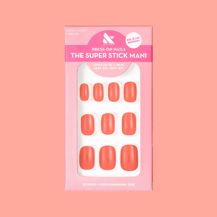 Lobster | Extra Short | Squoval - Tab Press-On nails in bright orangey red pink shown in packaging on coral background