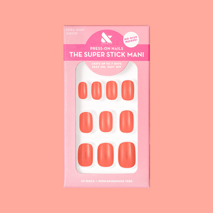 Lobster | Extra Short | Squoval - Tab Press-On nails in bright orangey red pink shown in packaging on coral background