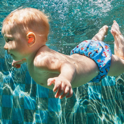 baby swimming with earplugs