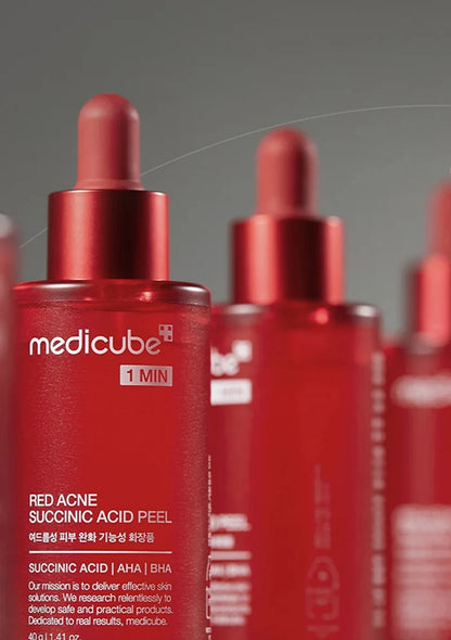 RedMedicube skincare product bottles on a gray background