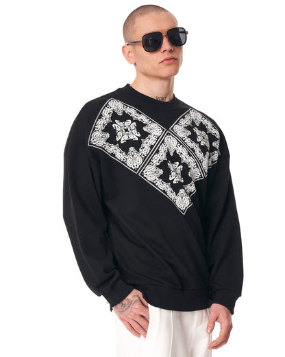 Martin Valen black men's oversized sweatshirt, midshot showing white V ethnic pattern and ribbed hem detail