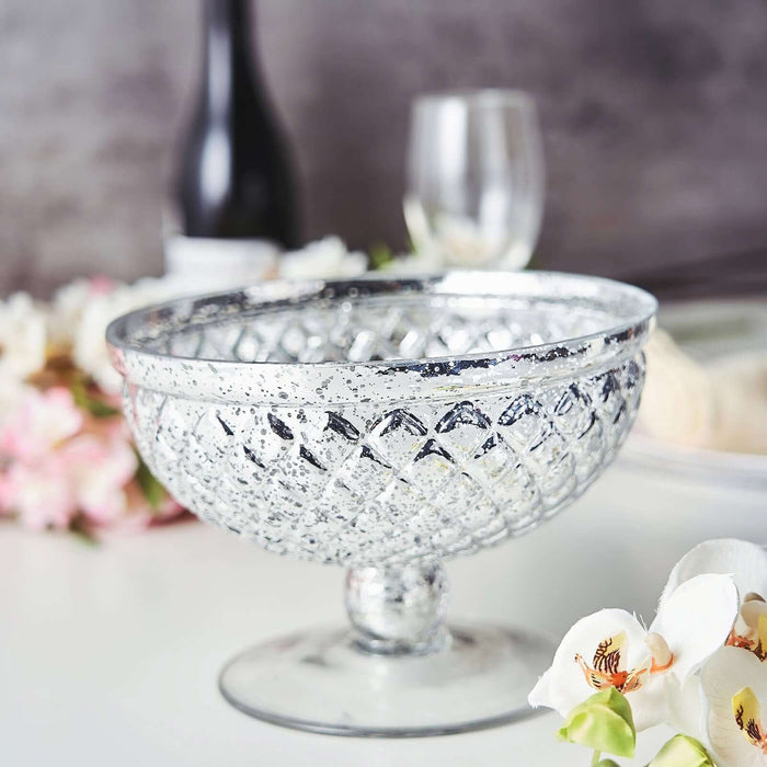 Vintage silver glass bowl with intricate design, perfect for decor or serving.