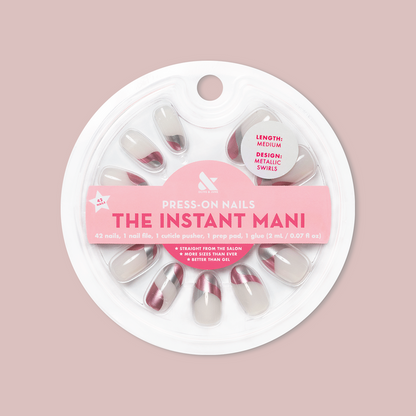 Metallic Swirls - Press-On | Medium | Oval false nails in two-tone metallic swirl design in circular packaging on soft pink background