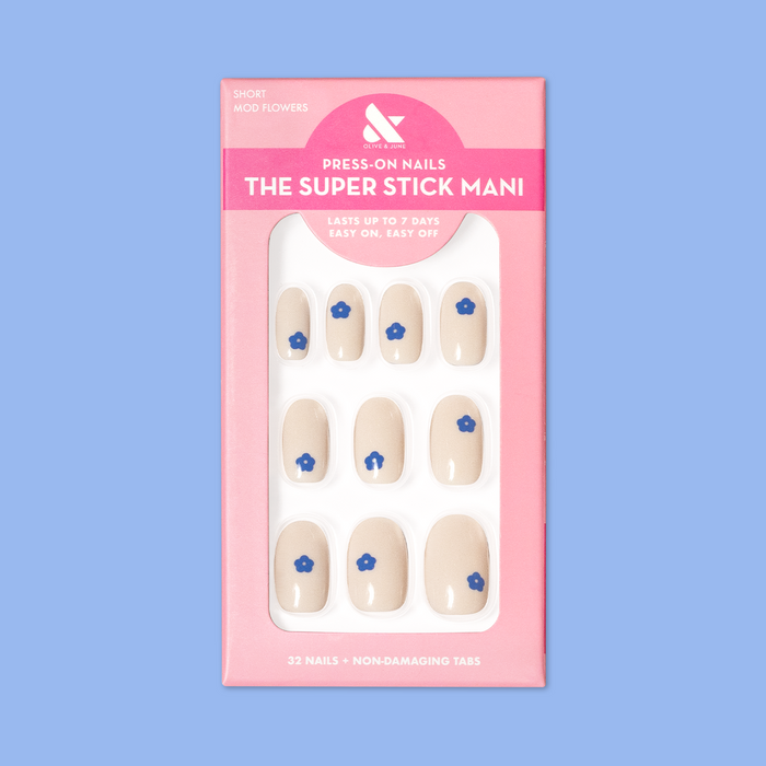 Mod Flowers | Short | Round - Tab Press-On nails in neutral polish with modern blue floral accents in pink packaging on blue background
