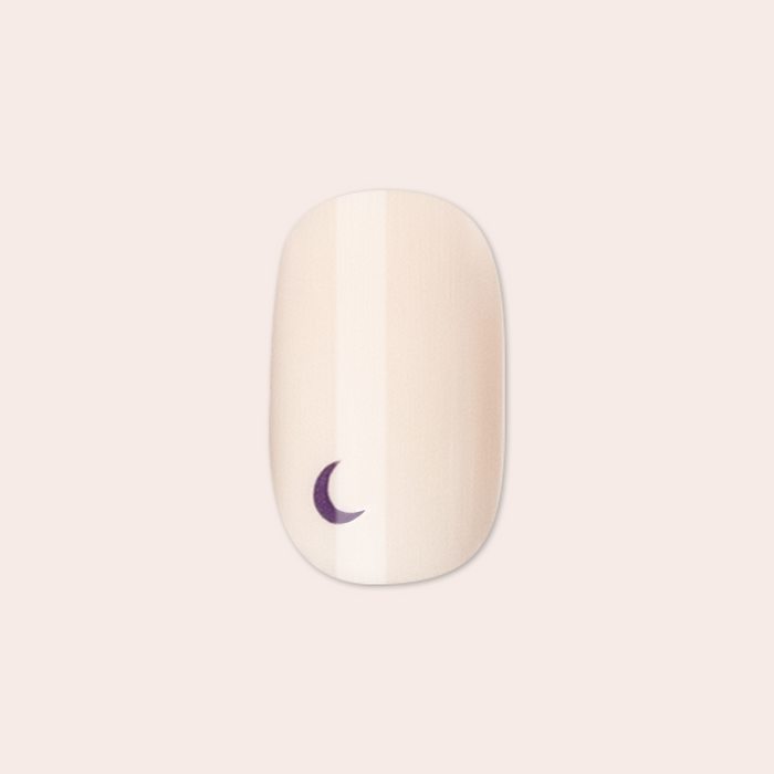 Moon Phases | Short | Squoval - Tab Press-On nail with neutral base and small crescent moon design on light background