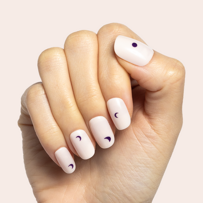Moon Phases | Short | Squoval - Tab Press-On nails with soft neutral base and minimalist dark moon phase designs on hand