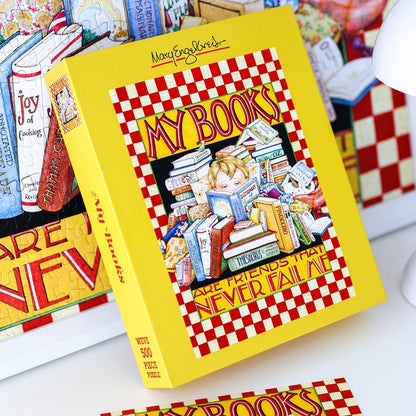 Sure! Here’s a rewritten version using the provided data: The WEVE My Books 500 Piece Jigsaw Puzzle is crafted from premium blue board and features an enchanting Mary Engelbreit illustration of a person surrounded by stacks of books.