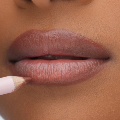 Pink Lipps Neutral Brown Everlasting Lip Liner swatch on medium to deep skin tone showing warm golden-brown pigmentation.