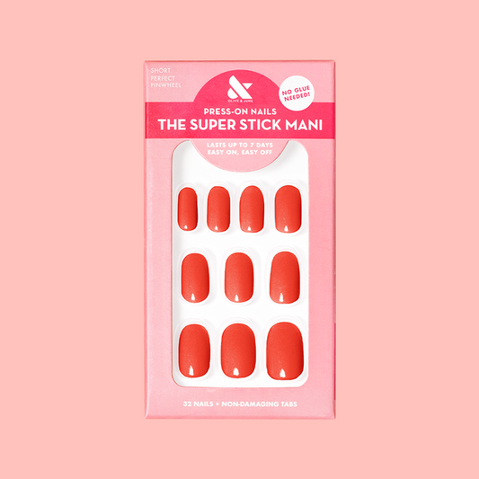 Perfect Pinwheel | Short | Round - Tab Press-On nails in cheerful coral shade for easy, long-lasting at-home manicure with tabs