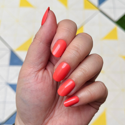 Perfect Pinwheel | Short | Round - Tab Press-On nails in vibrant coral for easy, quick at-home mani with smooth finish
