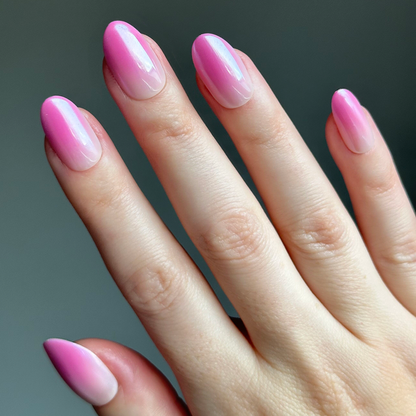 Pink Chrome Gradient | Medium | Oval - Tab Press-On nails with glossy pink to light gradient oval press-on manicure on hand