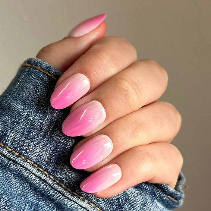 Pink Chrome Gradient | Medium | Oval - Tab Press-On nails with soft pink gradient and chrome shine in oval shape on hand
