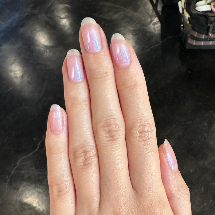 Pink Goldfish - Gel on natural nails showing soft pink iridescent shimmer for a graceful manicure by Olive and June