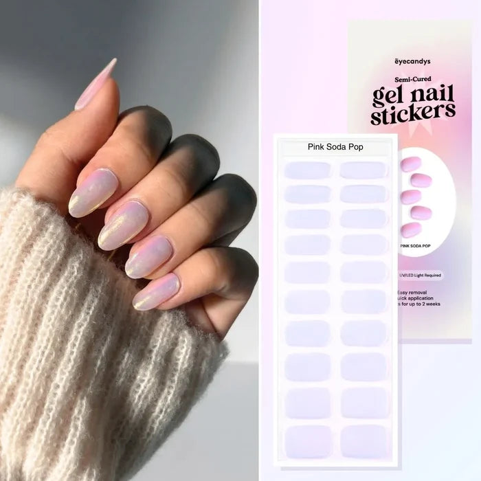 Close-up of hand wearing EyeCandys Pink Soda Pop Gel Nail Stickers in a shimmering hot pink design. Semi-cured gel nails with a glittery finish, ideal for creating bold, long-lasting spring or summer nail styles at home with ease.