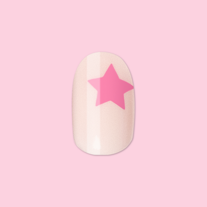 Pink Star Party | Extra Short | Round - Tab Press-On nail with soft pink base and bright star design on pink background