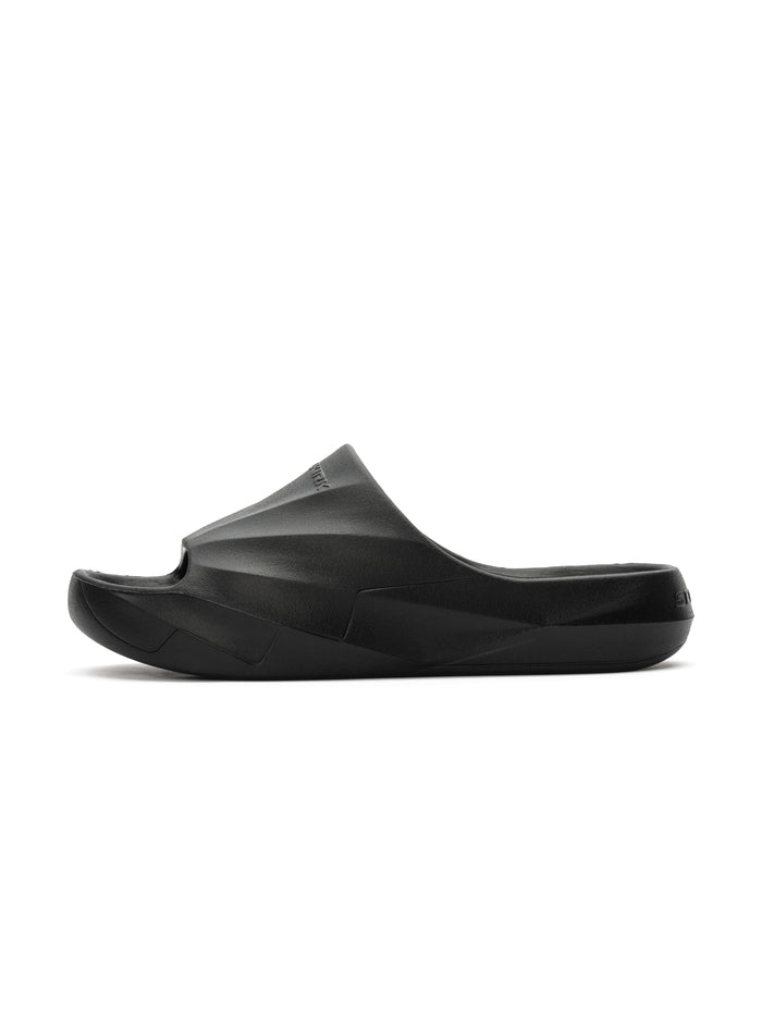 Black molded foam slide sandal with contoured footbed and textured sole