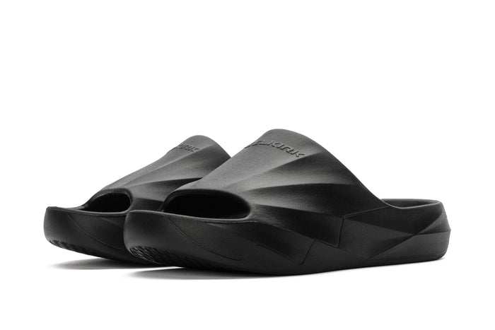 Black sculpted foam slip-on slides with open toe and contoured footbed