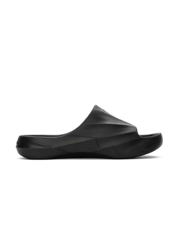 Black molded recovery slide with sculpted geometric upper and contoured footbed