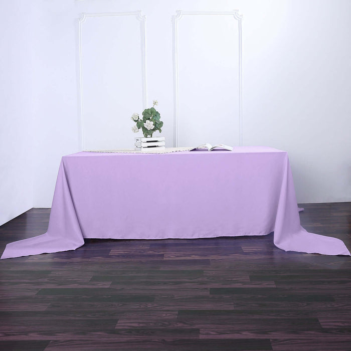 Purple tablecloth draped over a table in a studio setting.