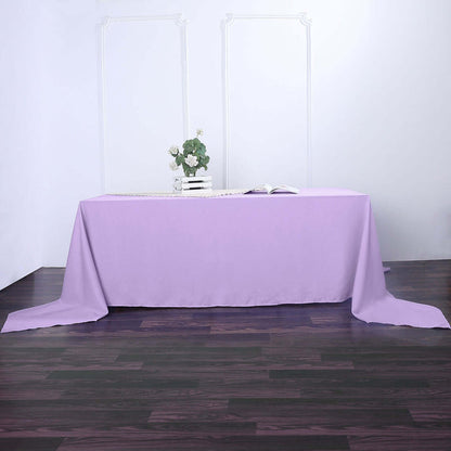 Purple tablecloth draped over a table in a studio setting.