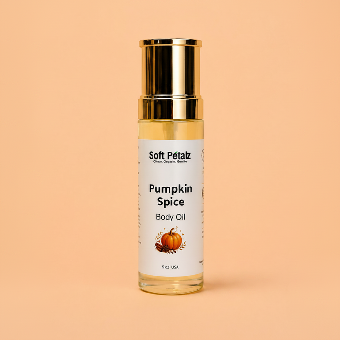 Bottle of Soft Pétalz Pumpkin Spice Body Oil on a peach background