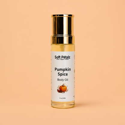 Bottle of Soft Pétalz Pumpkin Spice Body Oil on a peach background