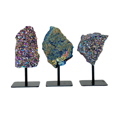 Three Rainbow Aura on Metal Base Stand on stands against a white background