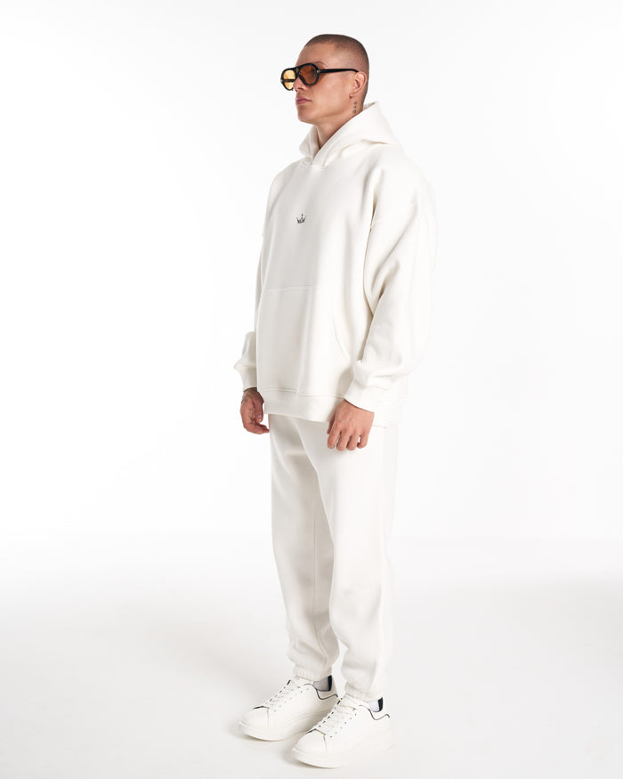 Martin Valen Regalia Crown white tracksuit set, full-length view showing oversized hoodie and matching sweatpants on model