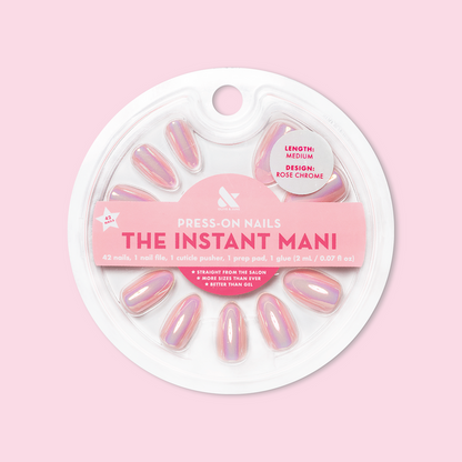 Round package of Rose Chrome - Press-On | Medium | Almond false nails with iridescent pink chrome finish on light pink background