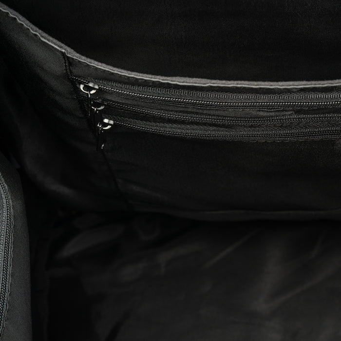 Black bag interior showing two zippered pockets and fabric lining