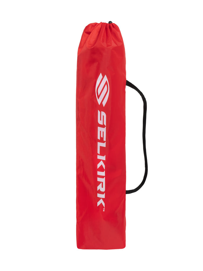 Red drawstring paddle bag with black shoulder strap and white vertical SELKIRK logo