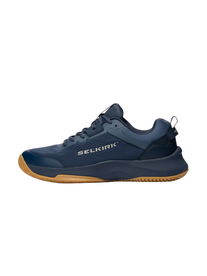 Navy athletic shoe with gum sole and SELKIRK logo on the side