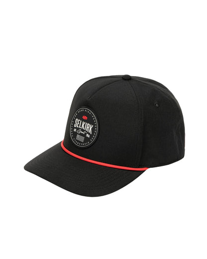 Black cap with circular patch reading SELKIRK Sport Est. 2014 and thin red cord above the brim