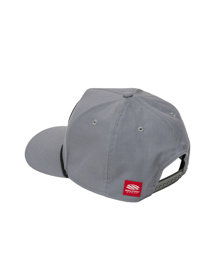 Gray six-panel snapback hat with flat brim, adjustable rear snap closure and red brand tag.